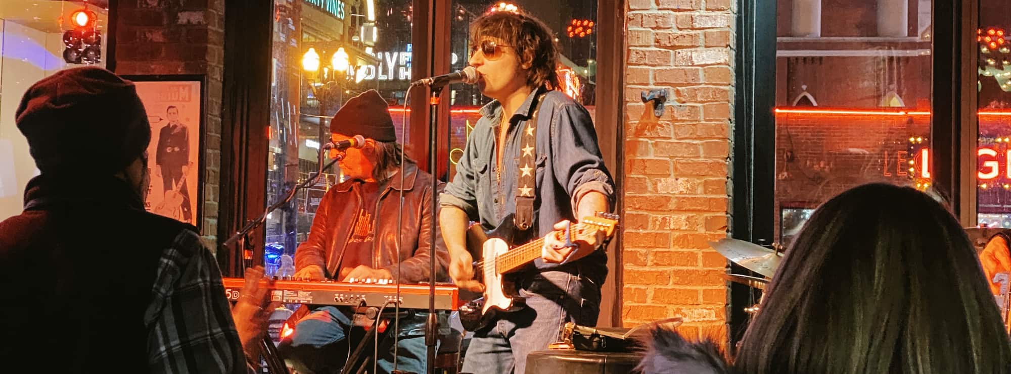 bar singer on guitar in Boston